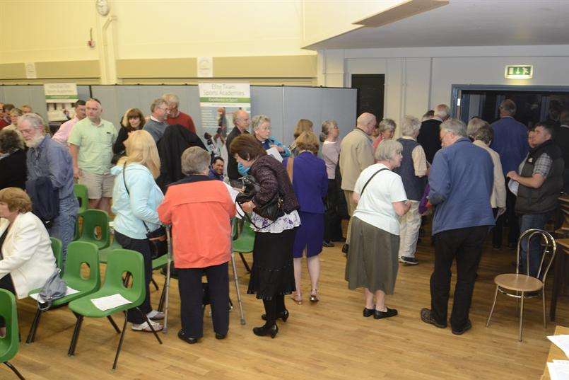 People leave the hall when the meeting was described as a presentation on the future of the Pilgrims Hospice in Canterbury