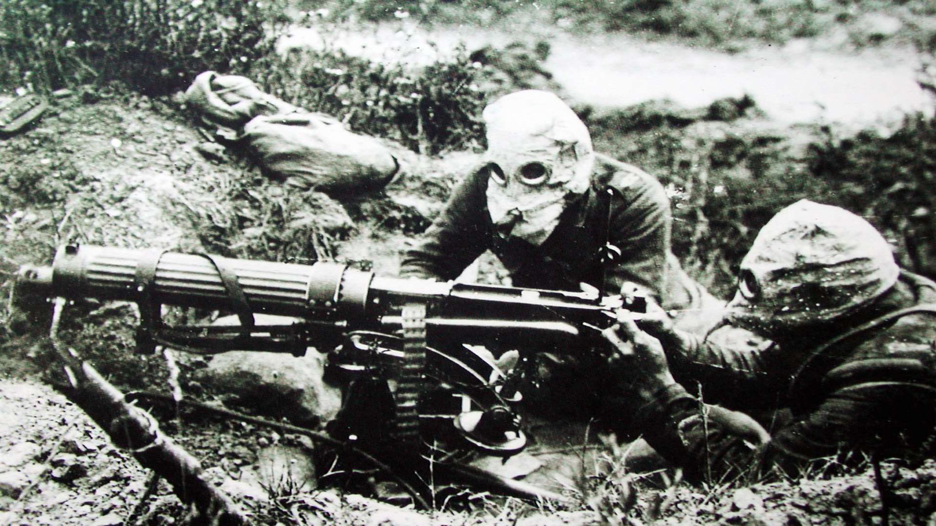 British machine gunners wearing gas masks in the Battle of the Somme.