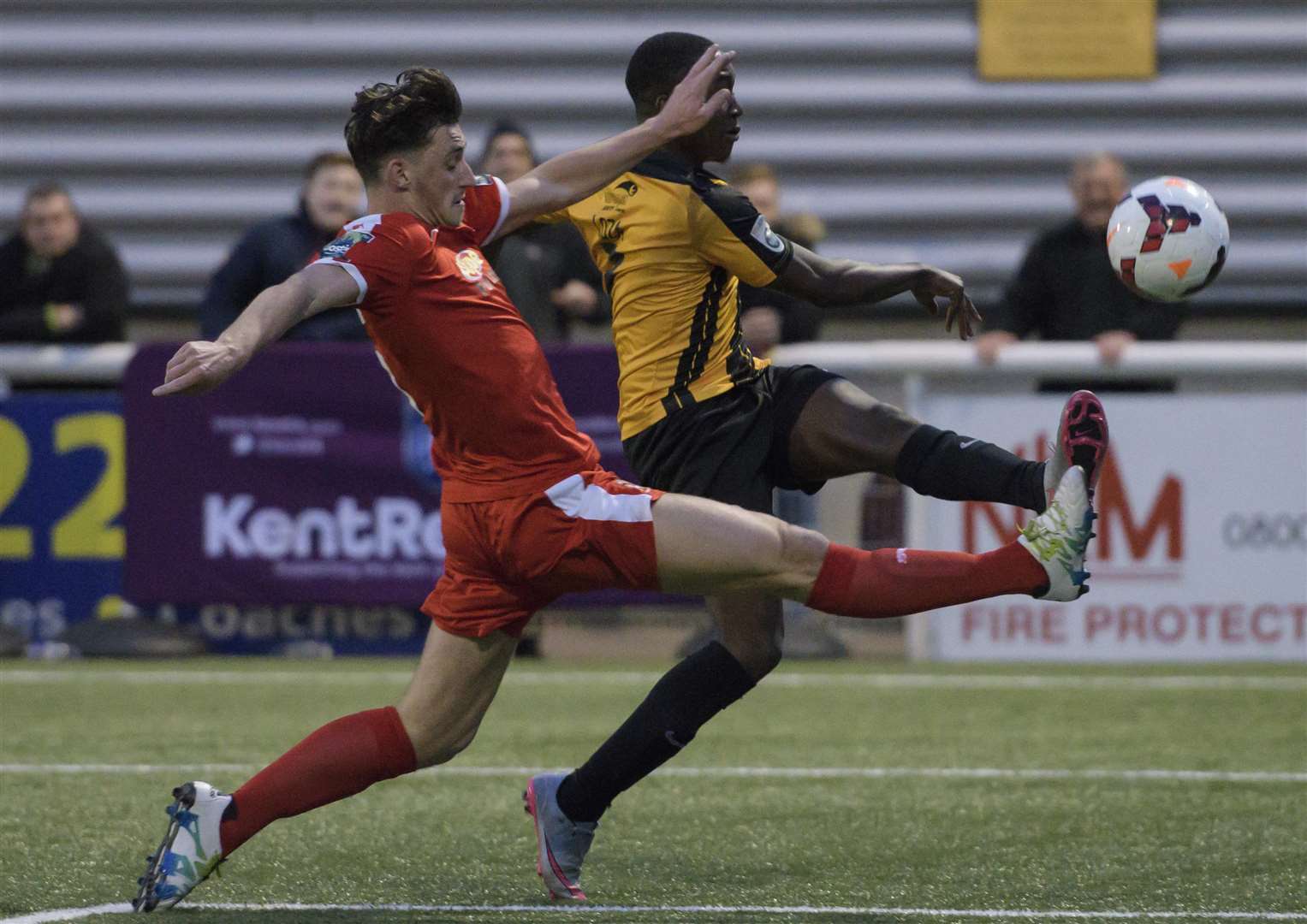 Folkestone's Sam Hasler stretches to block Jamar Loza's cross Picture: Andy Payton