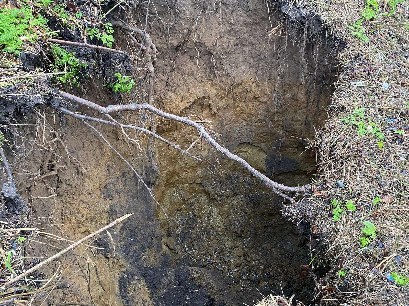 The sinkhole can be seen to be a number of metres deep. Picture: Paul Watts