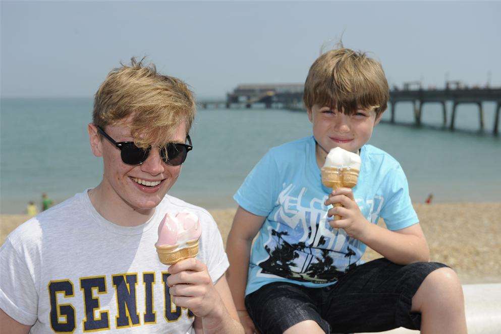 Jason Hale, aged 17, and Oliver Hale, aged nine, enjoy an ice cream on Deal beach