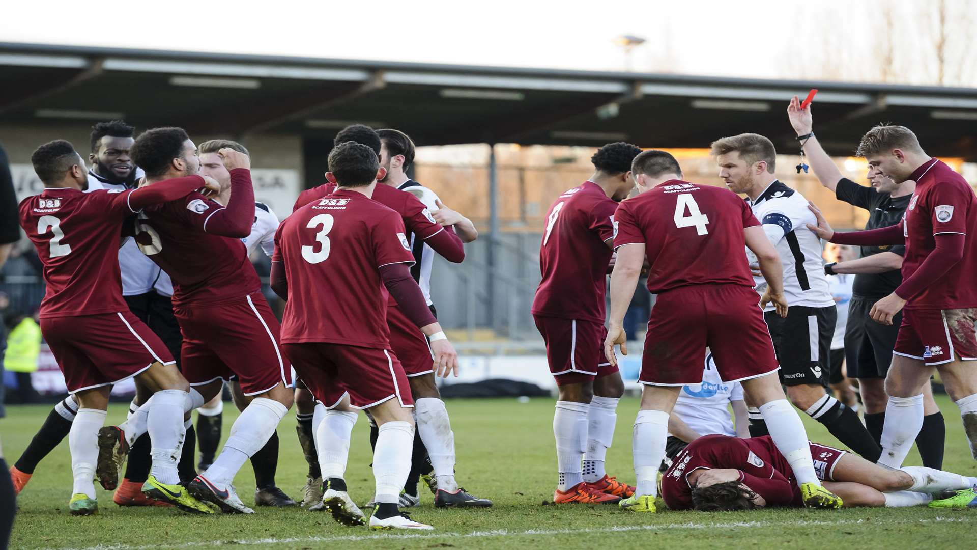 Alex Brown (obscured on ground) sees red after his challenge on Chelmsford's Anthony Church Pix Andy Payton