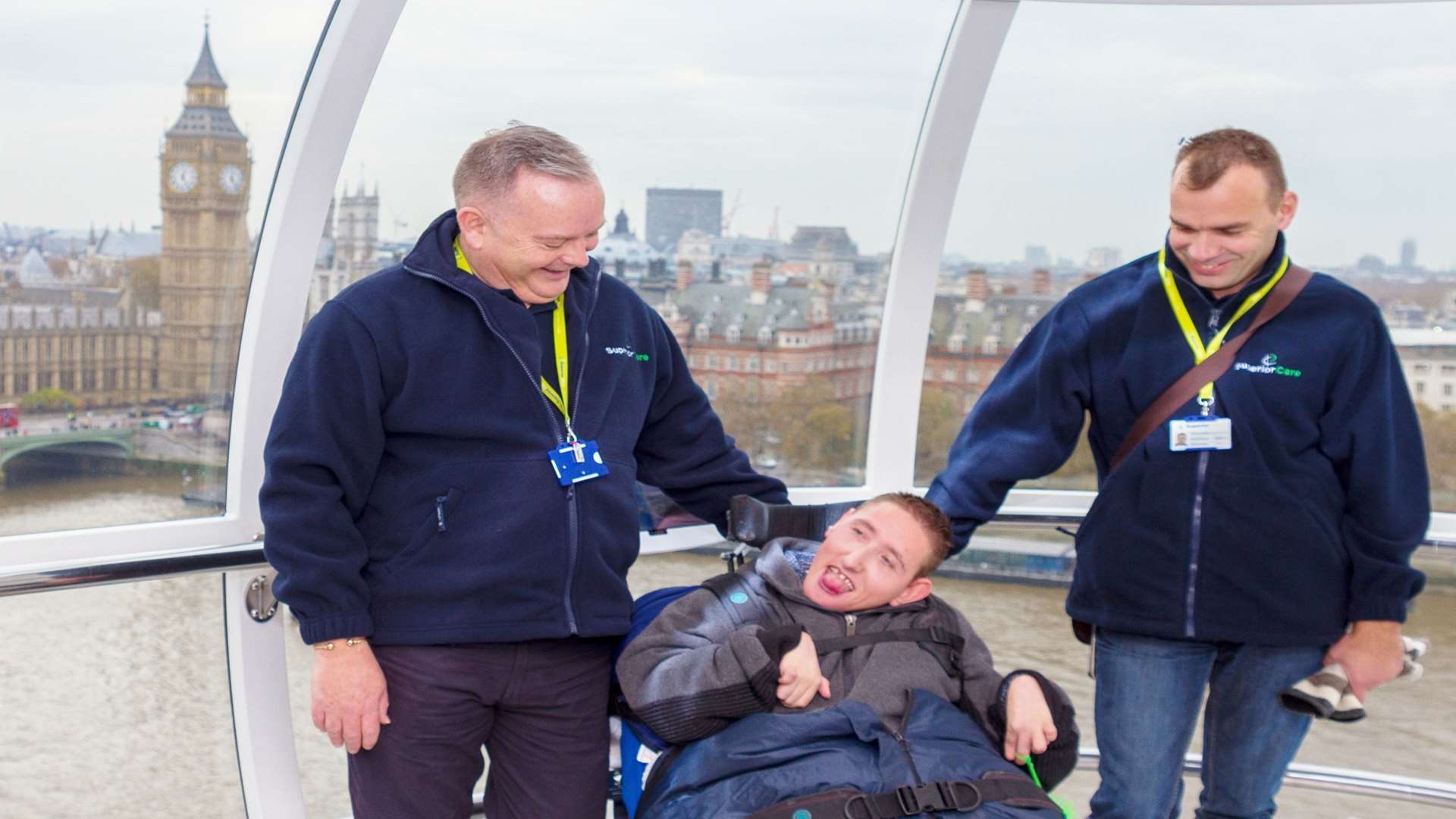 Superior Care carers Iain, left, and Stefan taking long-term client Luke out for a day trip in London