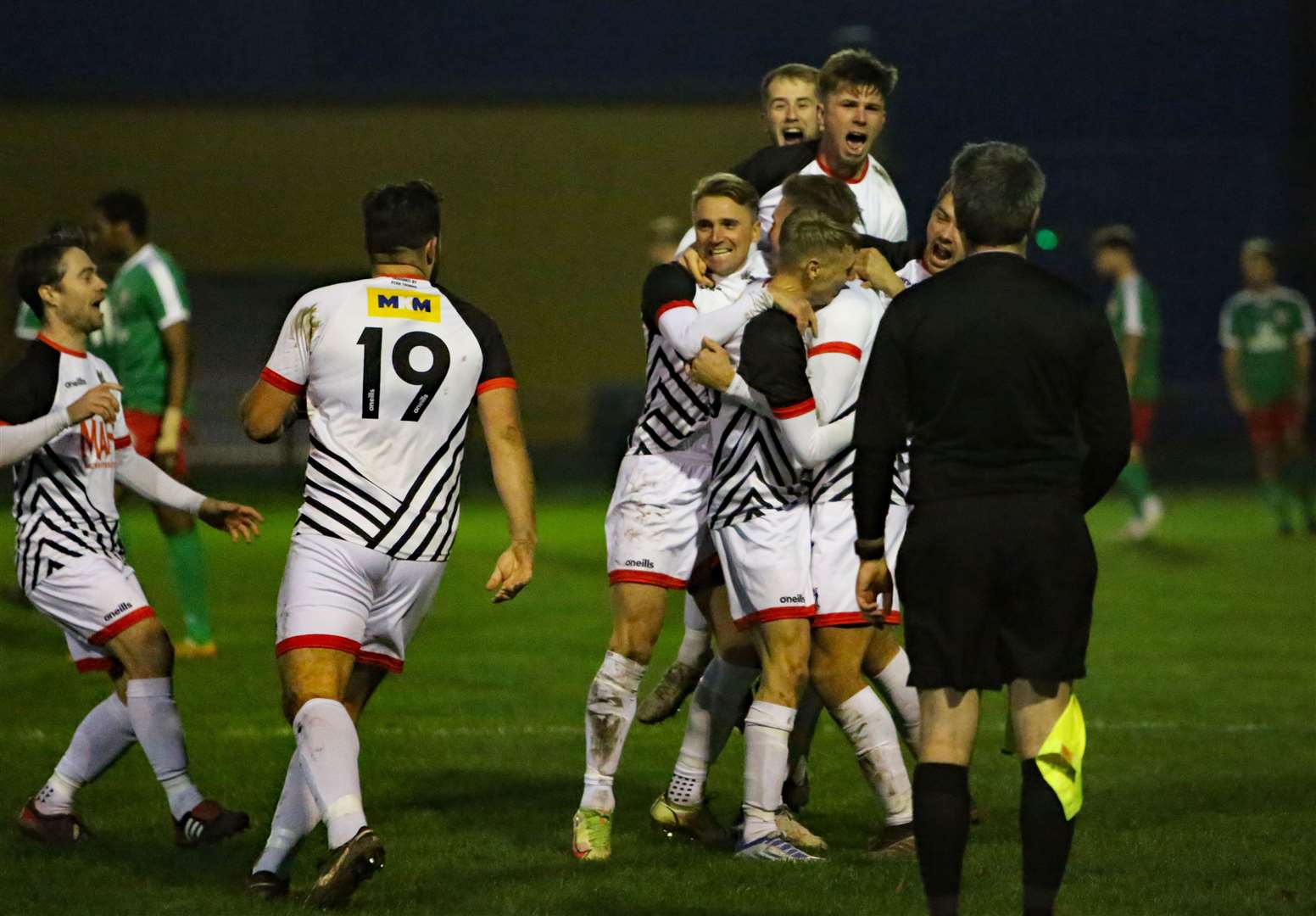 Deal Town's players celebrate Aaron Millbank's goal as they progressed in the FA Vase at Sporting Bengal. Picture: Paul Willmott