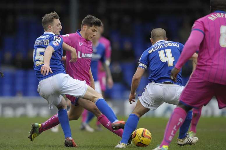 Connor Smith in the thick of the action against Oldham Picture: Barry Goodwin