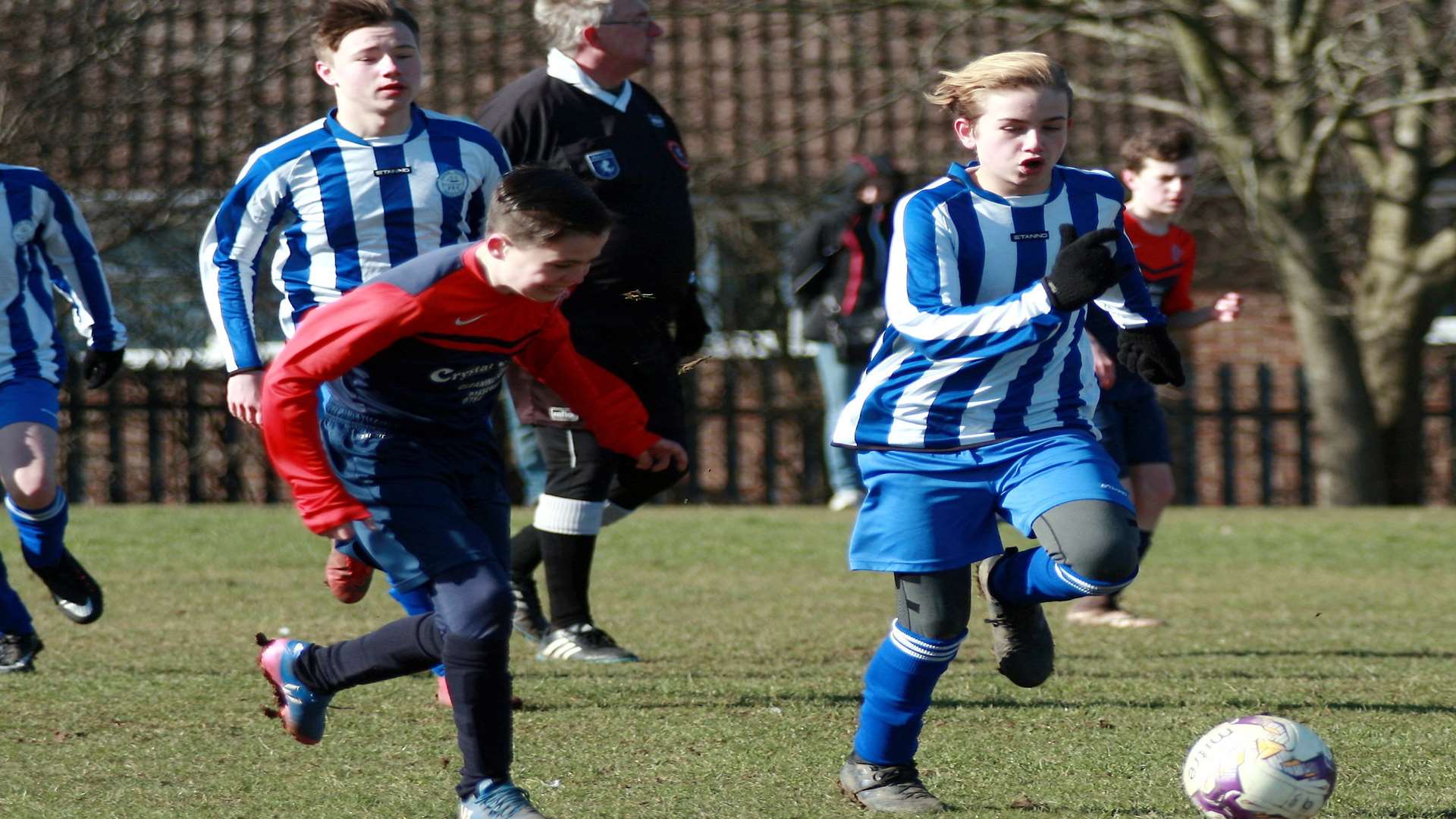 Hempstead Valley under-14s, left, and Chatham Riverside Rangers under-14s in a race for the ball Picture: Phil Lee