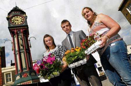 Hayley Stammers and Louis Roach, from Ward and Partners, and Laura-May Dolan, from the Secondhand Furniture Shop, refresh the clock tower planters