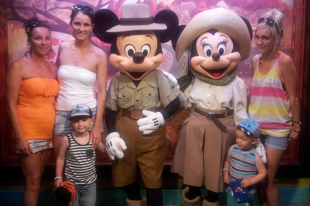 Kayleigh Duff, far right, and family meet Mickey and Minnie on their holiday at Disney World, Florida