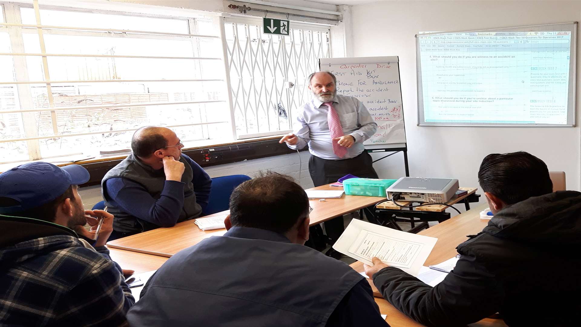 A group of Syrian refugees are being taught health and safety by Martin Carnall