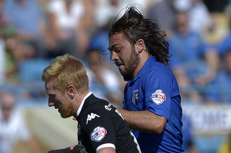 Bradley Dack fights for possession against Wigan Picture: Barry Goodwin
