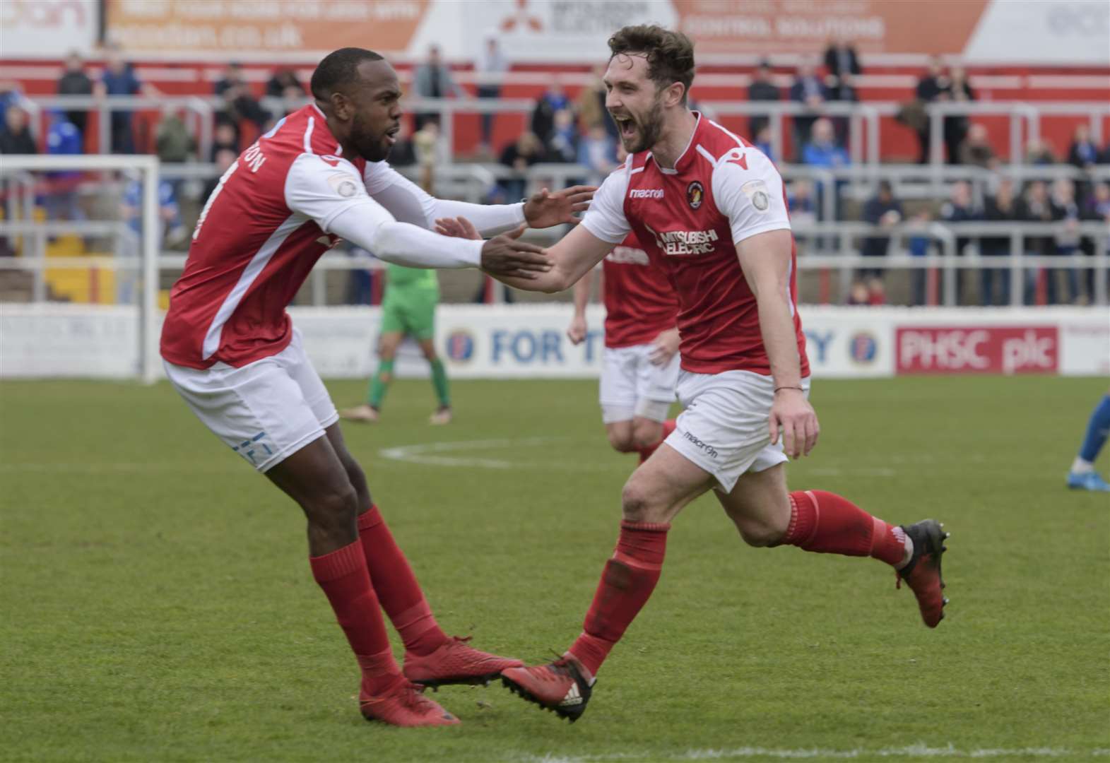 Dean Rance celebrates his equaliser with Myles Weston Picture: Andy Payton