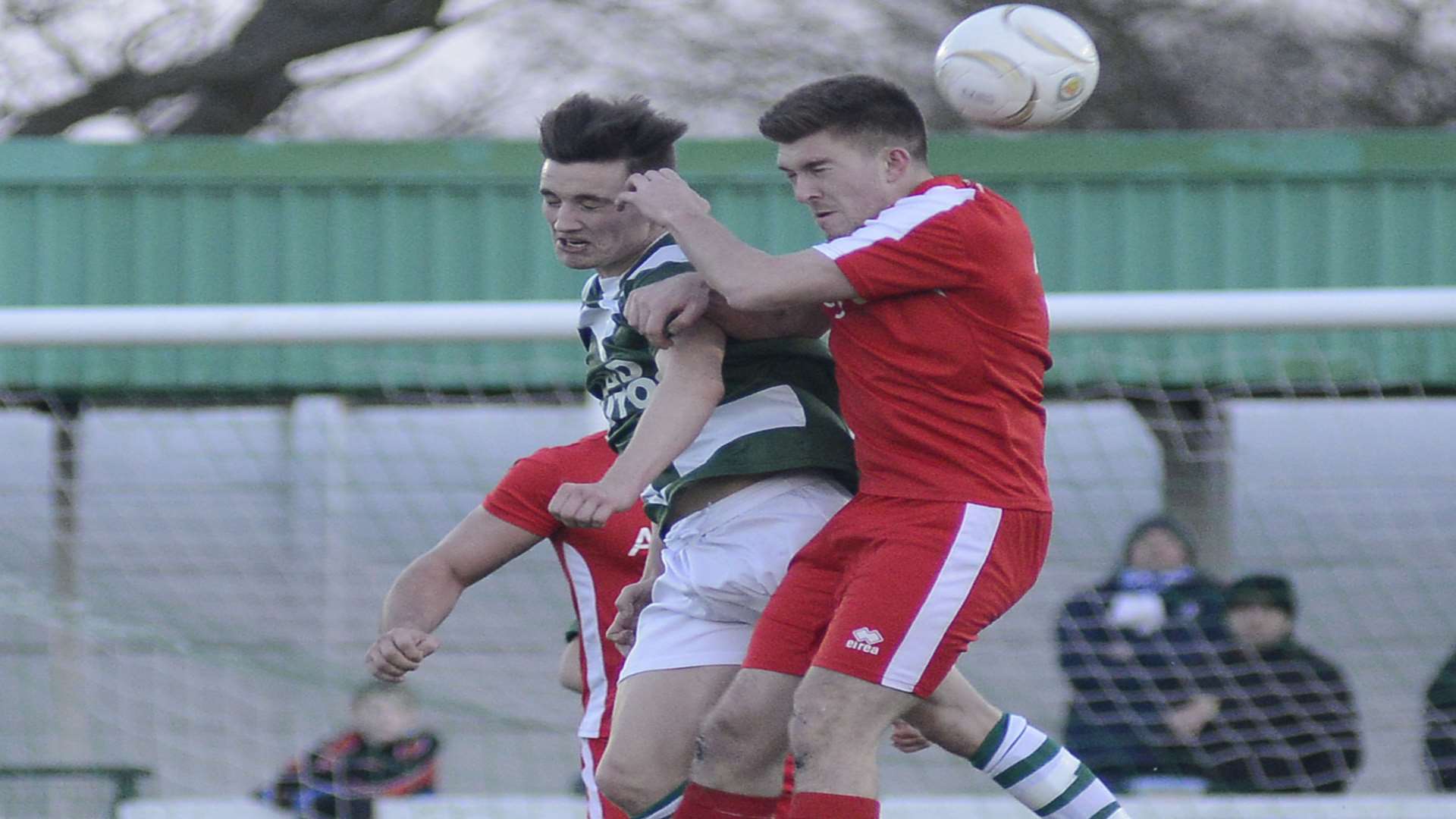 EYES SHUT: Josh Woolley challenges for the ball in an aerial duel during Ashford United's 1-1 FA Vase draw at Homelands Pic: Paul Amos