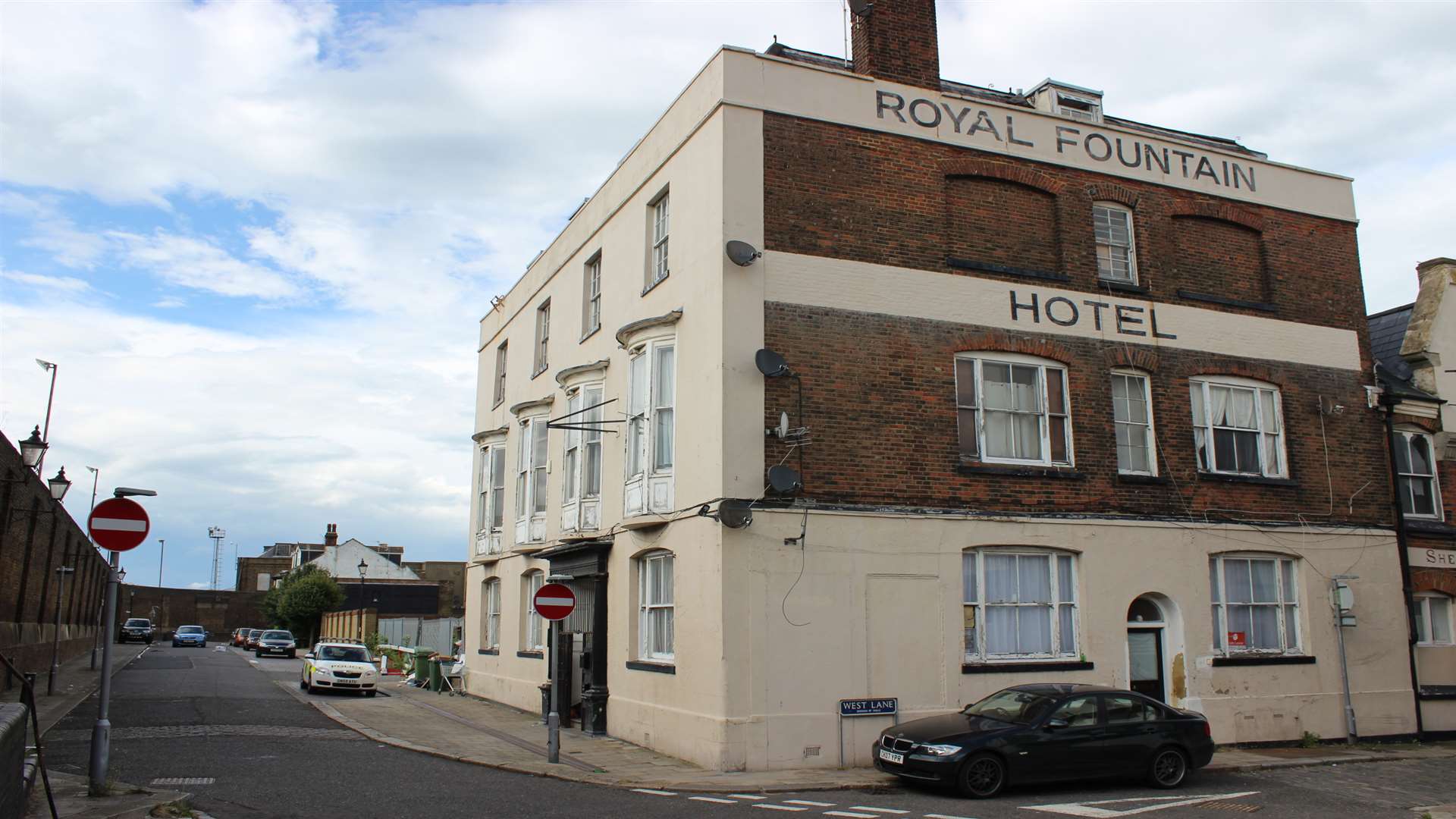 Police car outside flats in the former Royal Fountain Hotel, Blue Town, Sheerness