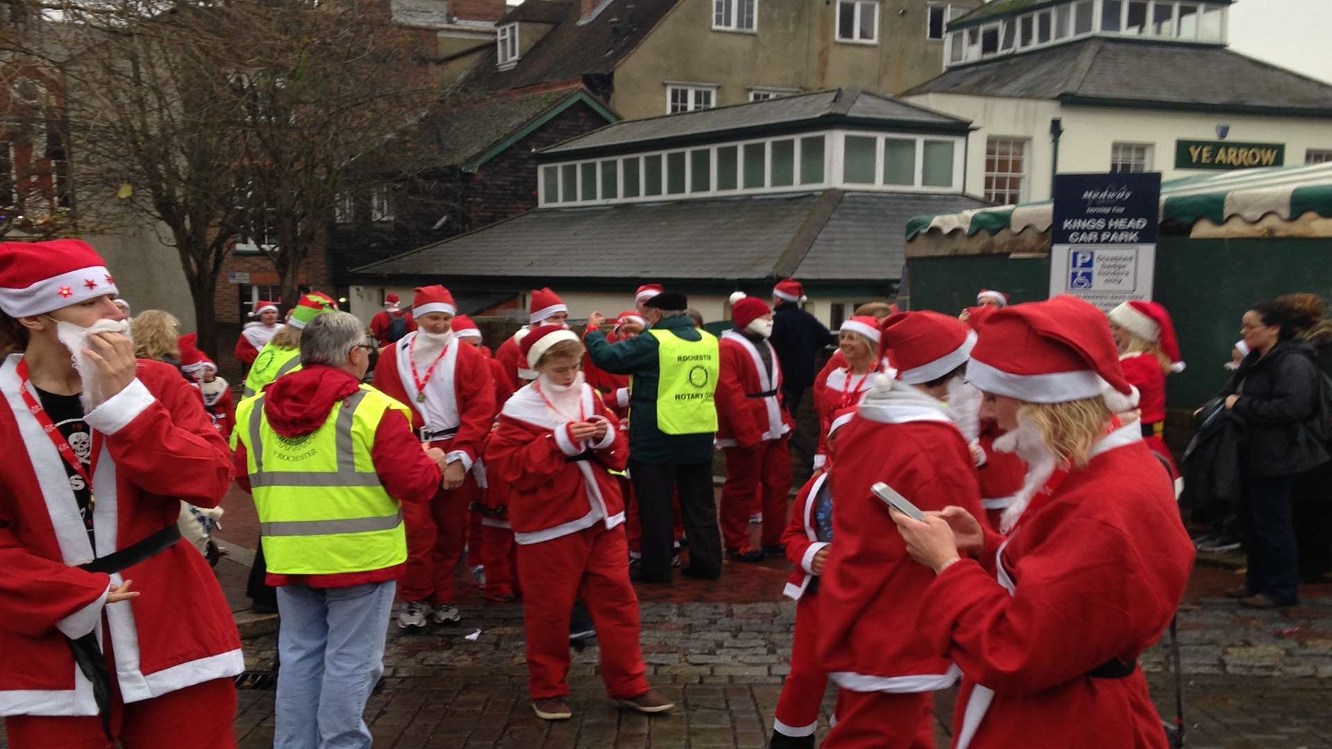 Some of the first Santas over the finish line.