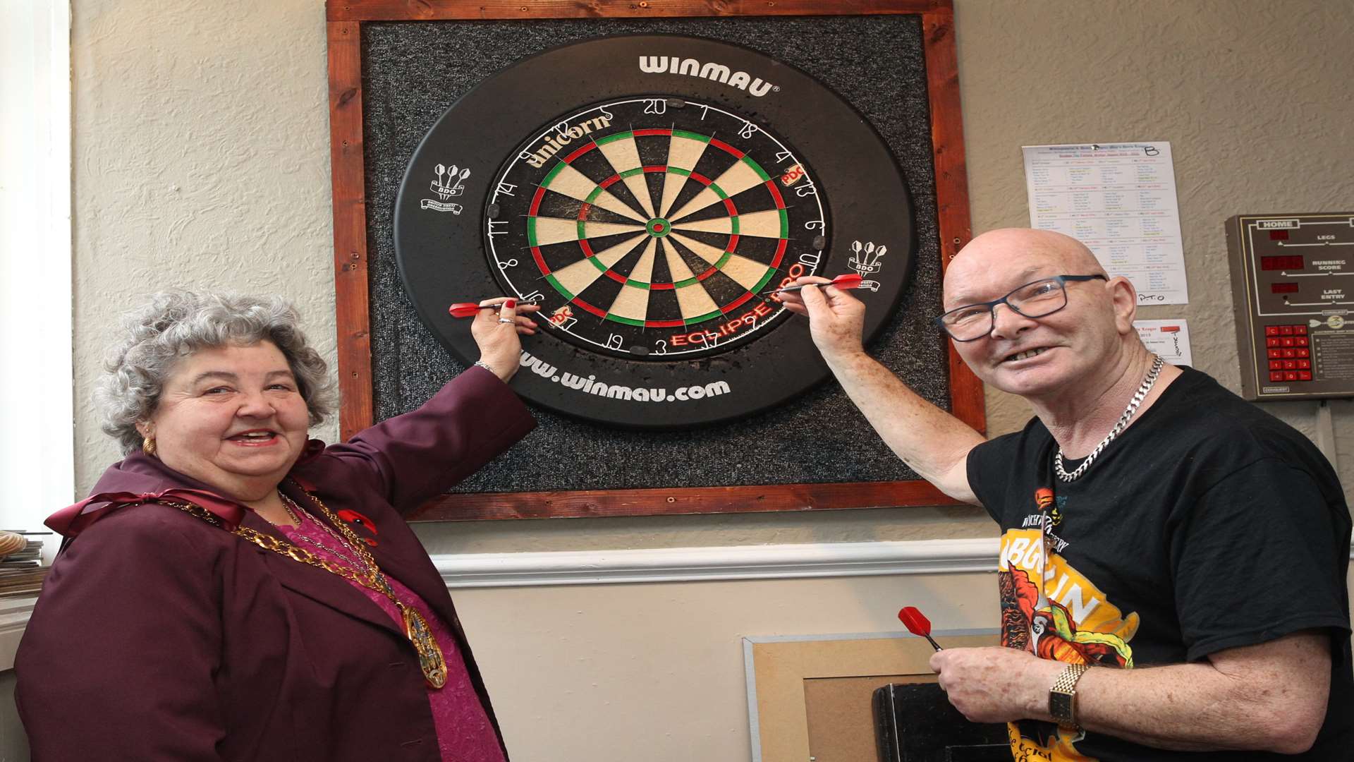 The Mayor of Swale, Cllr Anita Walker with Ted Hannaford, Landlord of The King's Head at the start of a 24-hr darts marathon.