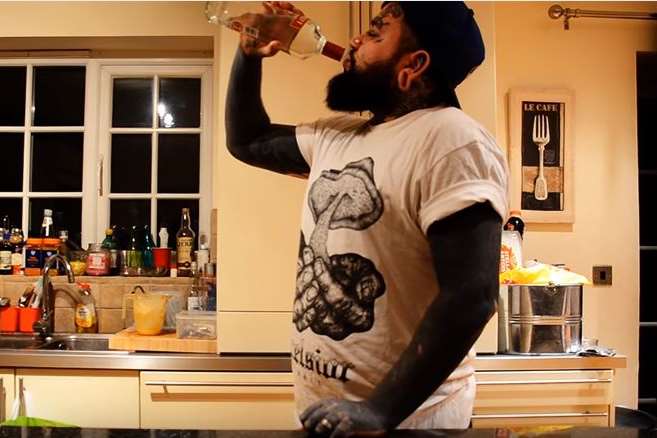 Andi Doherty, aka Skat Dagger, films himself necking a bottle of vodka in a minute. Picture: Land Pirates/YouTube