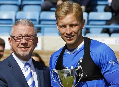 Josh Wright with his award and Gills chairman Paul Scally Picture: Andy Jones