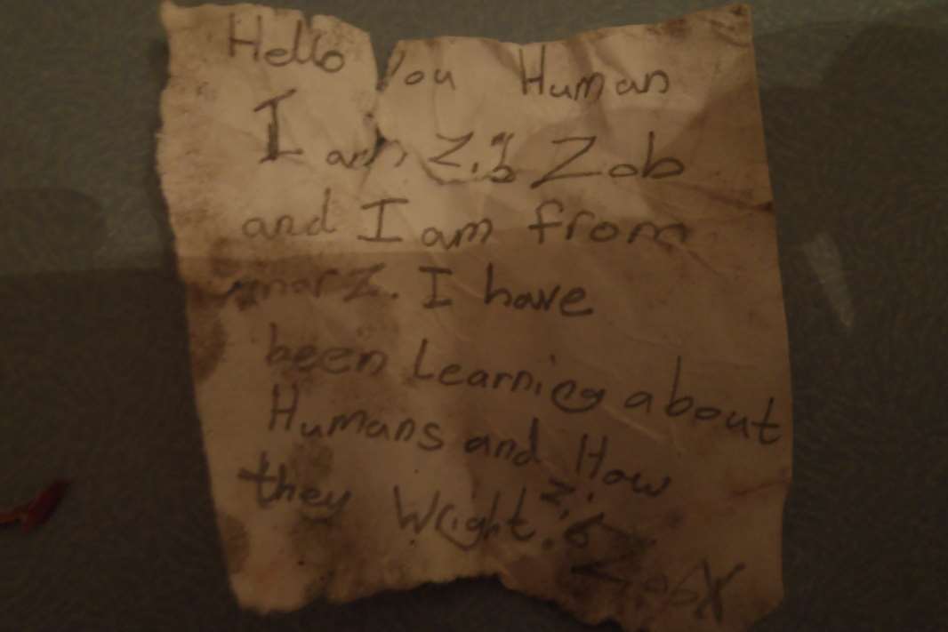 Zib Zob's letter reads: 'Hello you Human, I am Zib Zob and I am from Marz.'