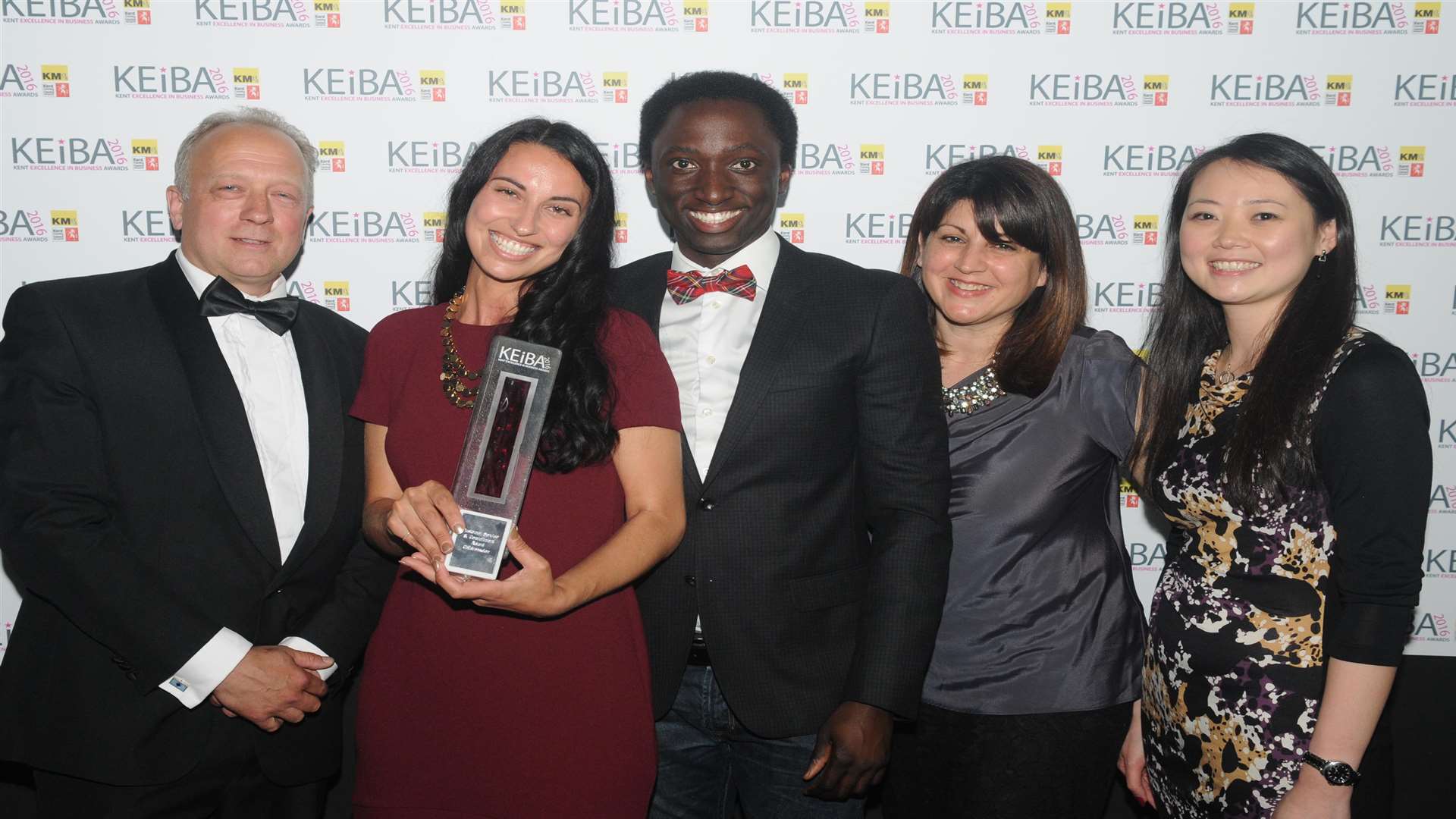 Winning at KEiBA, from left, sponsor Roger Pitt with Childrensalon staff Affie Scott-Read, Hassan Luwalira, Denise Hamilton and Mel Ng