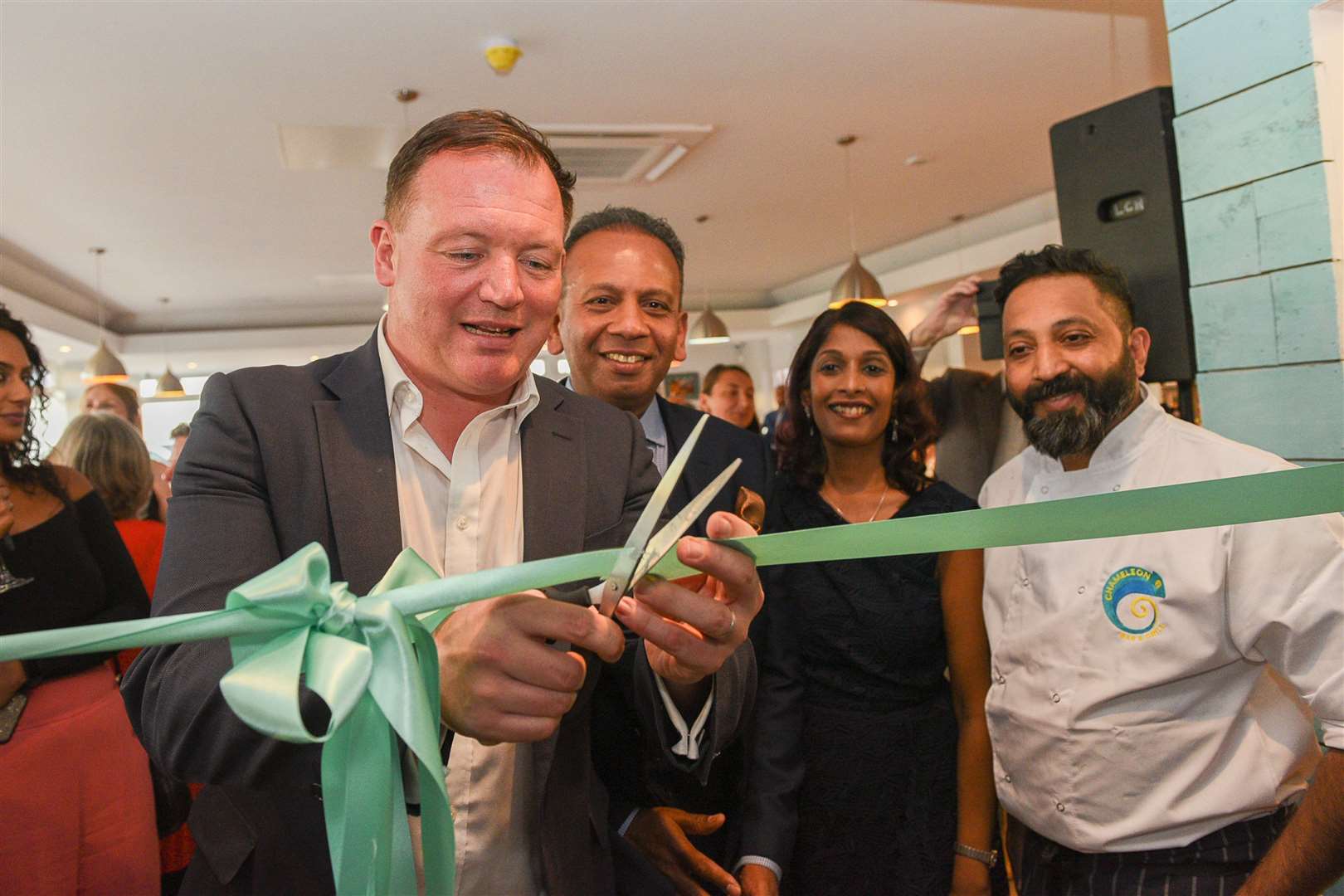 MP Damian Collins cuts the ribbon at the official opening