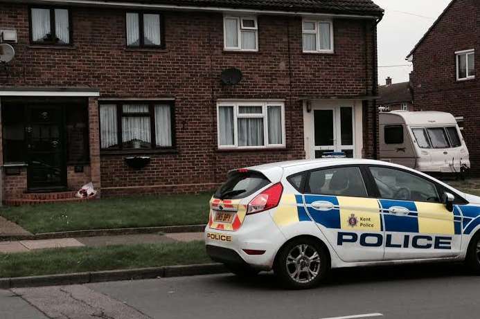 Floral tributes were left outside the victim's home in Rectory Road, Sittingbourne