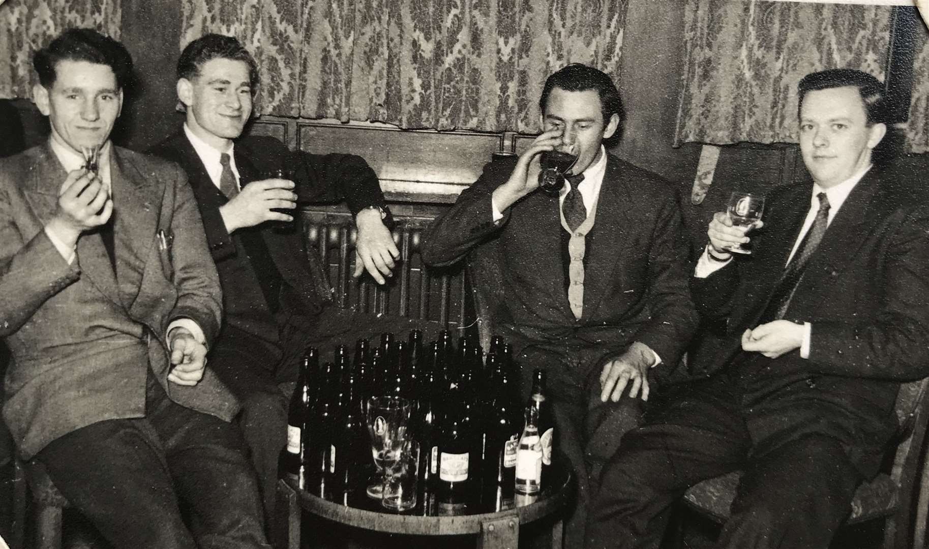 Peter Newman on the right relaxing with pals, his chum Mike is two along from him