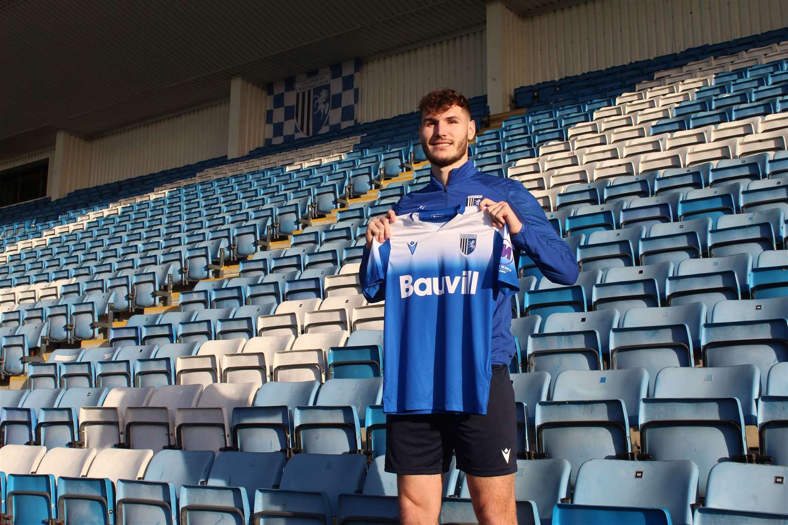 Striker Josh Andrews has joined Gillingham on a permanent deal from Birmingham City