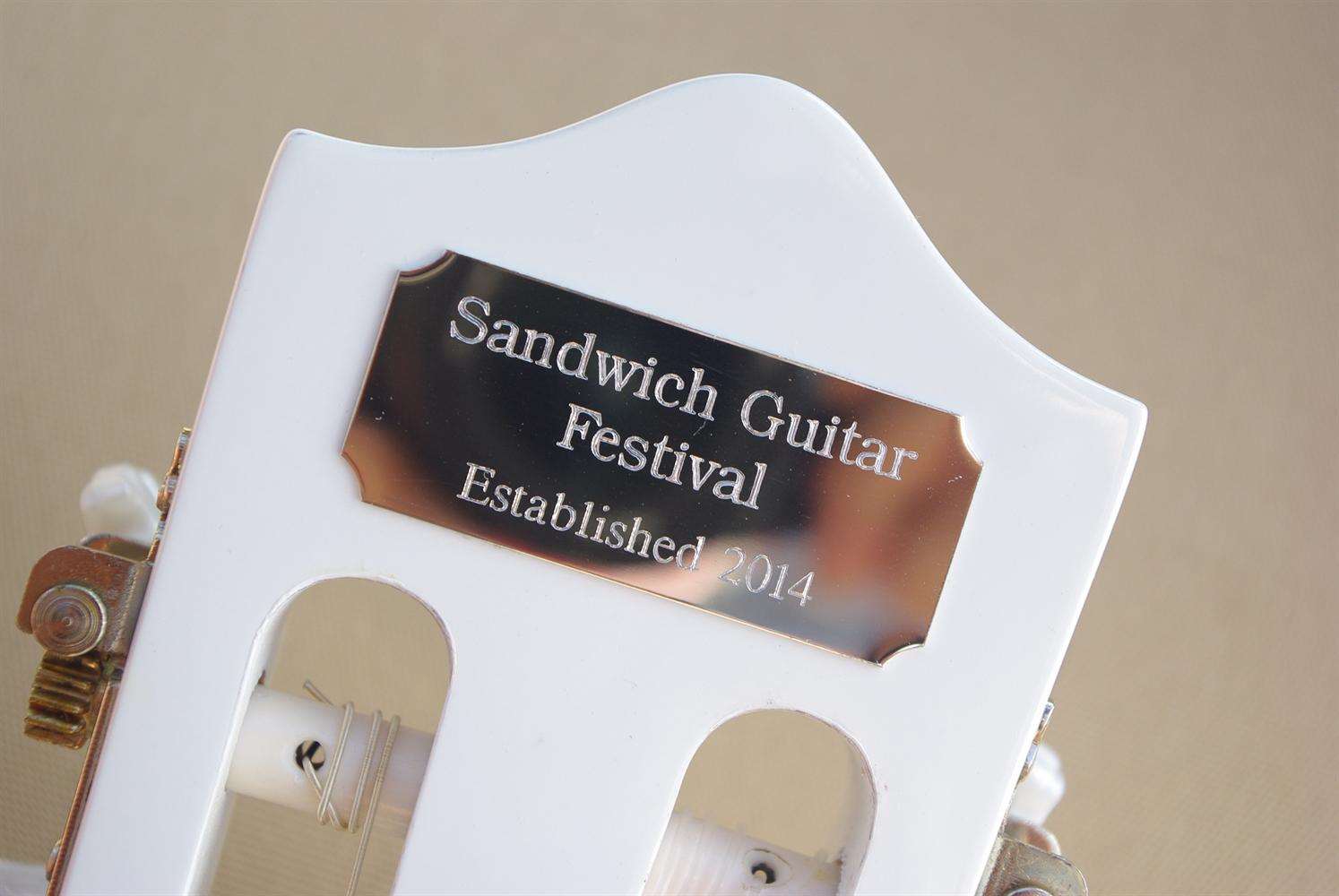 Guitarists and audiences can sign the guitar for a donation