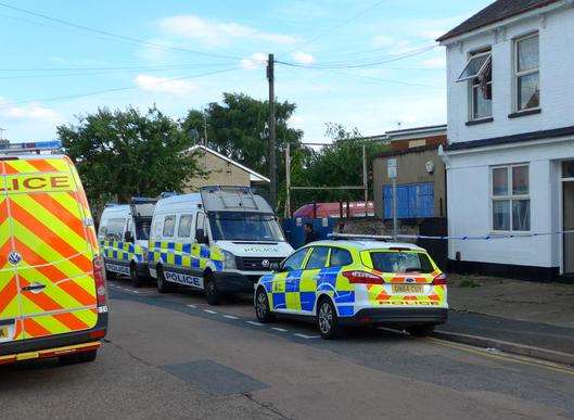 Police vehicles outside the home in Grove Road, Strood. Picture: @Kent_999s