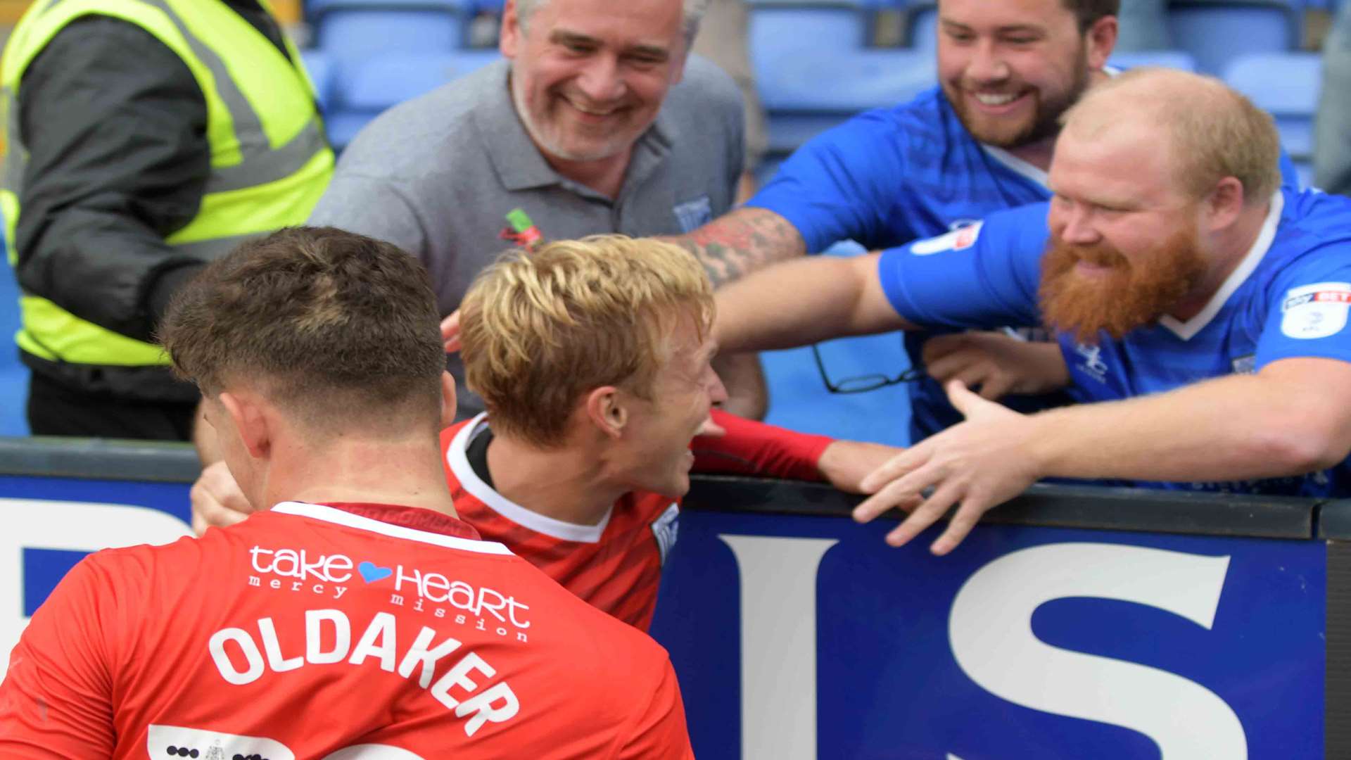 The fans get up close with the players to celebrate Max Ehmer's winner Picture: Barry Goodwin