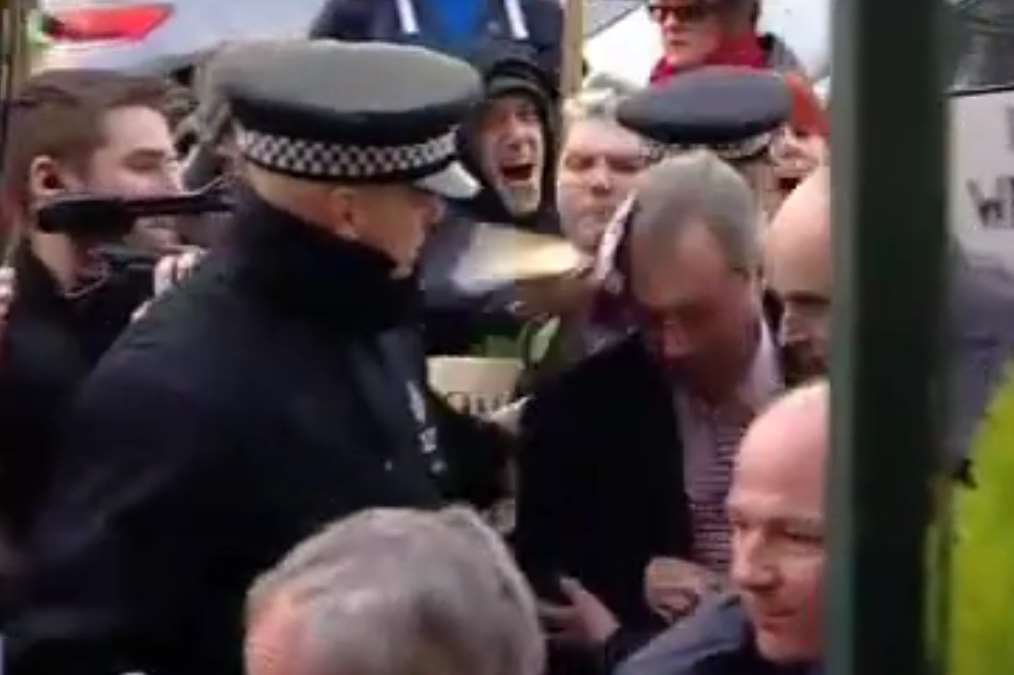 UKIP leader Nigel Farage is hit over the head in Cliftonville. Picture: ITV Meridian