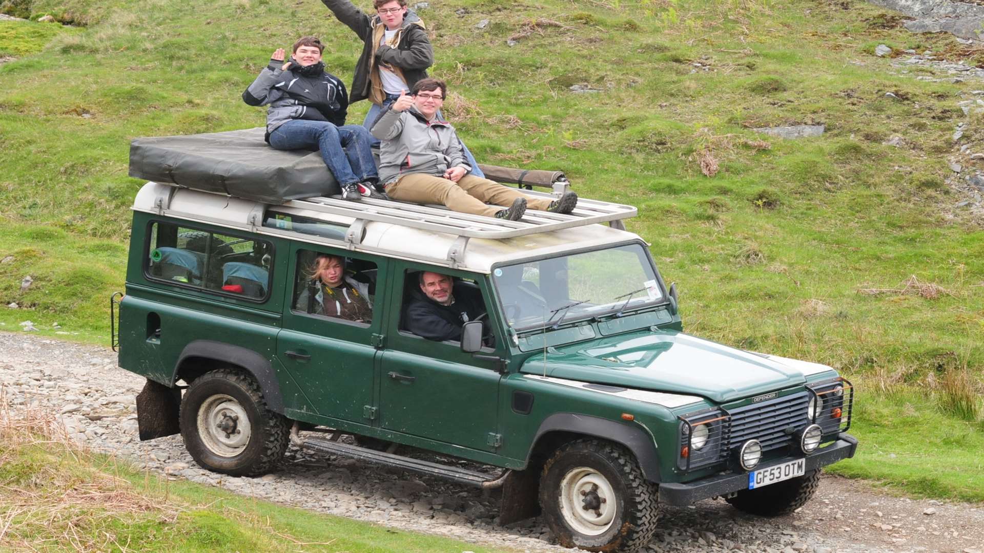 The family on holiday in the Land Rover taken from their home.