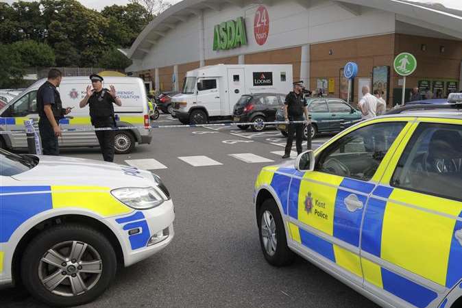 Police surround a Loomis van at Asda in Chatham after it was attacked by armed raiders. Picture: Andy Payton