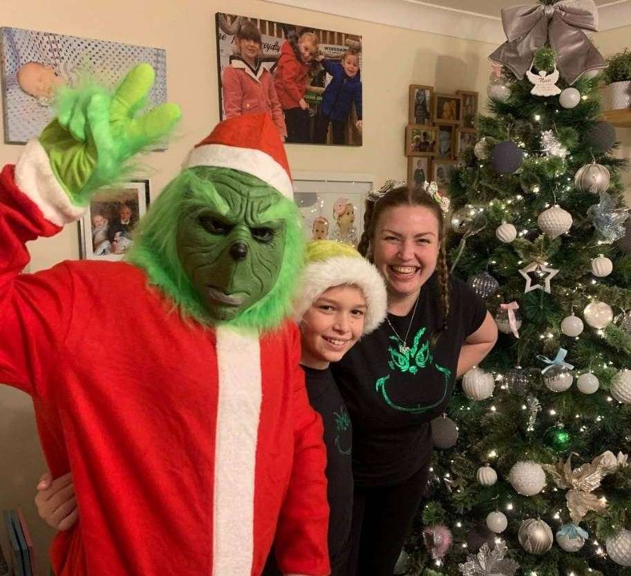 Izzy Zort (Grinch), Rachel Zort and their son, Brogan have been playfully spreading Christmas gloom. Photo: Rachel Zort