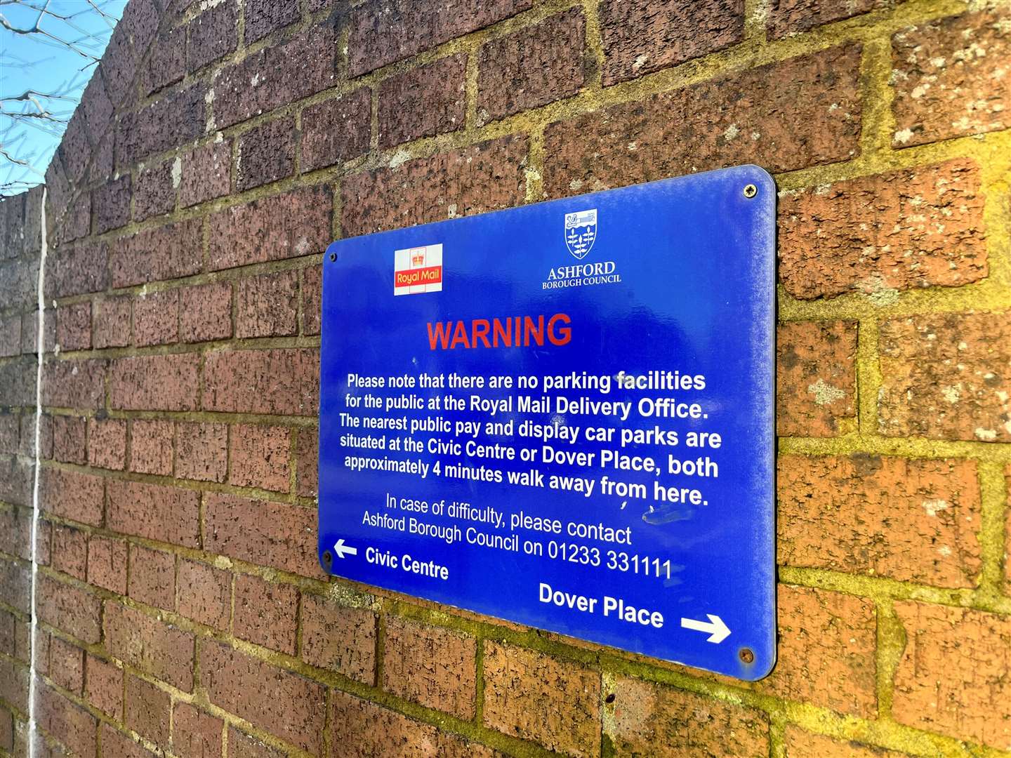 An old notice outside the sorting office – stating there are no parking facilities – is yet to be removed