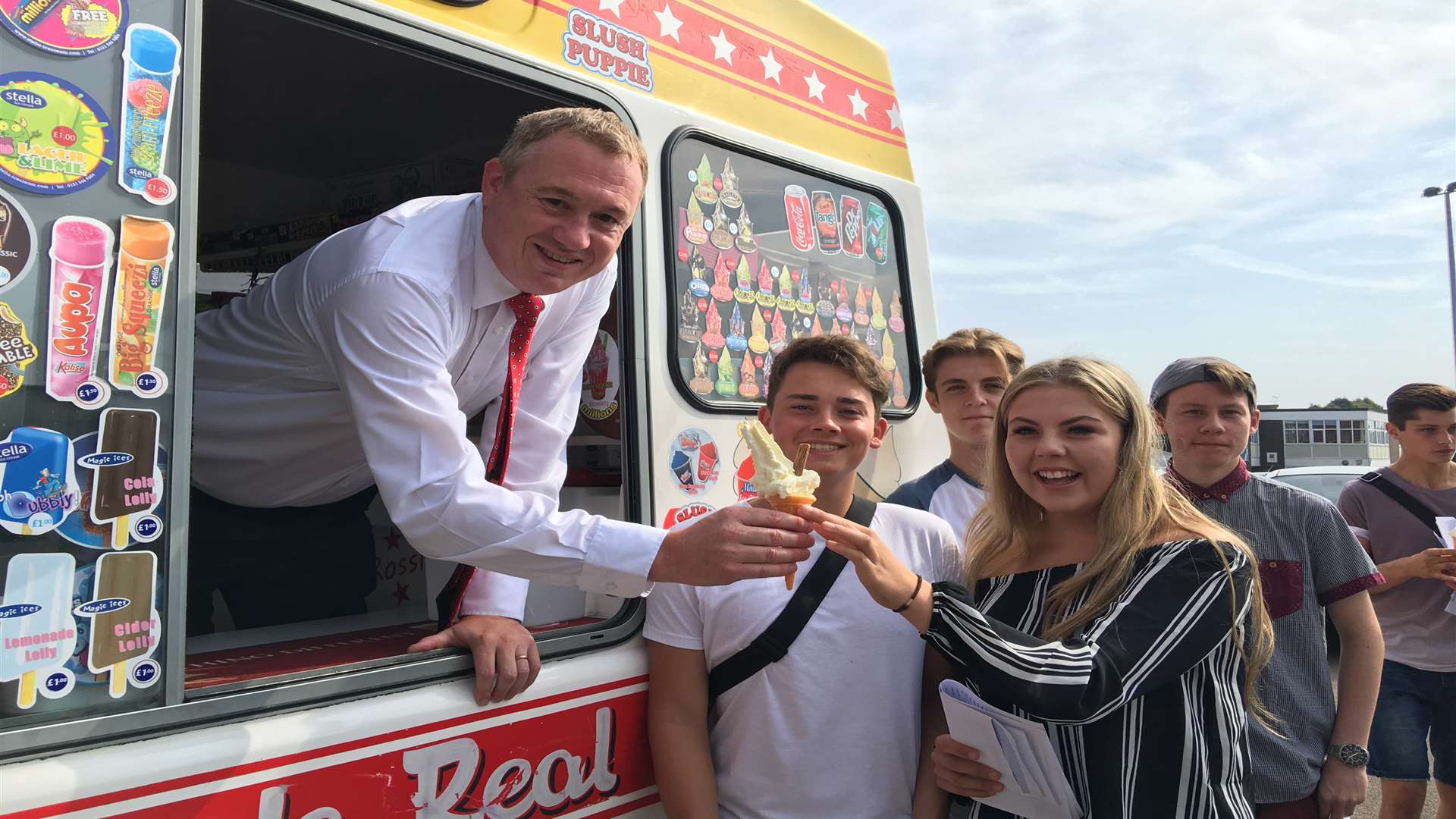 Westlands School head teacher Simon Cox serving ice creams to pupils