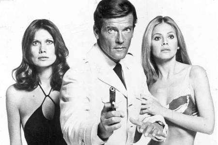 Britt Ekland with Roger Moore and Maud Adams in 1974 film The Man with the Golden Gun.