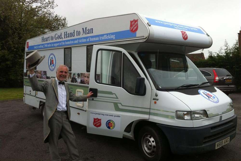 Salvation Army trekker Andy Peddle with his motorhome support vehicle.