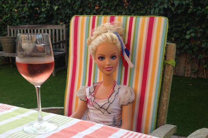 "Chardonnay" enjoys a glass of wine in Claire's garden.