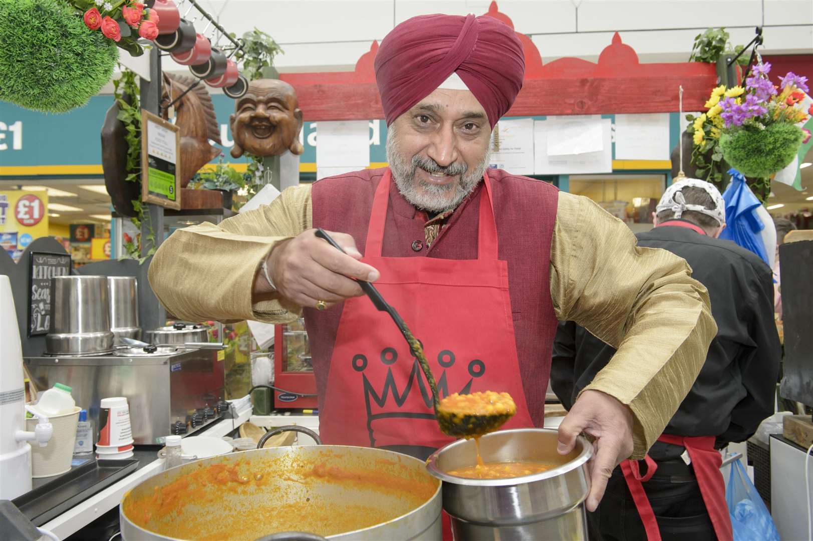Andy Singh on his stall. Indian street food seller and character Andy Singh holds a fundraiser for charity Making Miracles, at his stall in the Thamesgate Shopping Centre, Gravesend. .Picture: Andy Payton. (55440316)