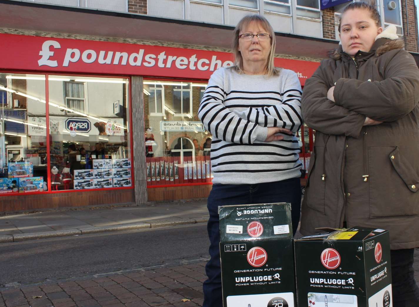 Sharon Cumber and her daughter Michelle with their Hoovers outside Poundstretcher in Sheerness