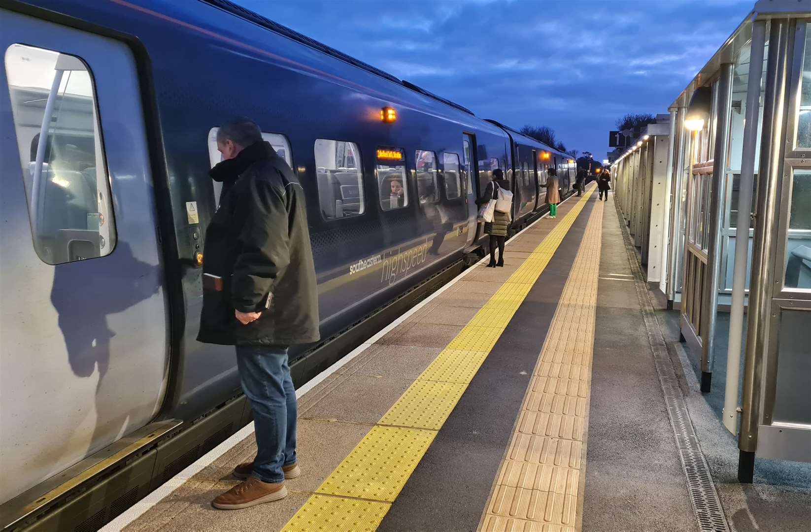 Commuters boarding an early morning train from Thanet Parkway
