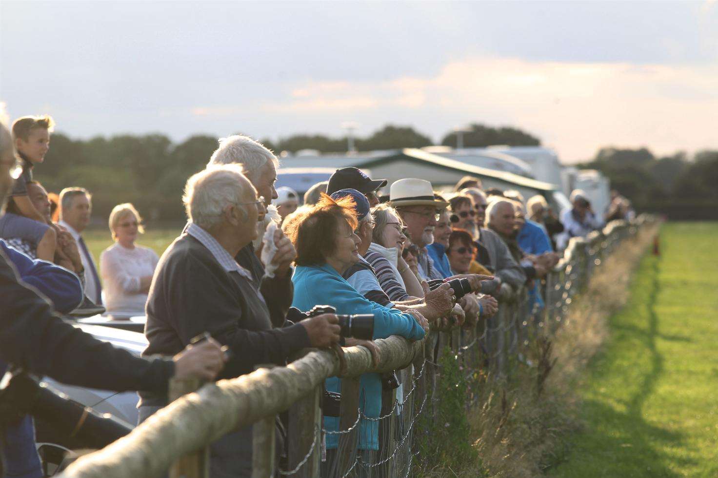 Crowds watch on as Sue Kerkin and Gordon McKee wing walk for Pakinsons UK