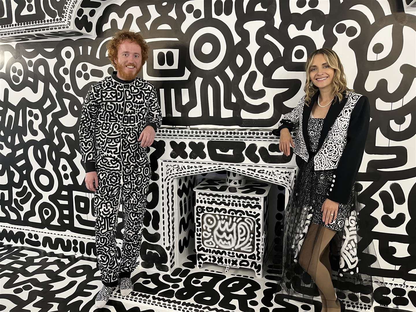 Sam Cox and his wife Alena Cox in his Mr Doodle house in Tenterden