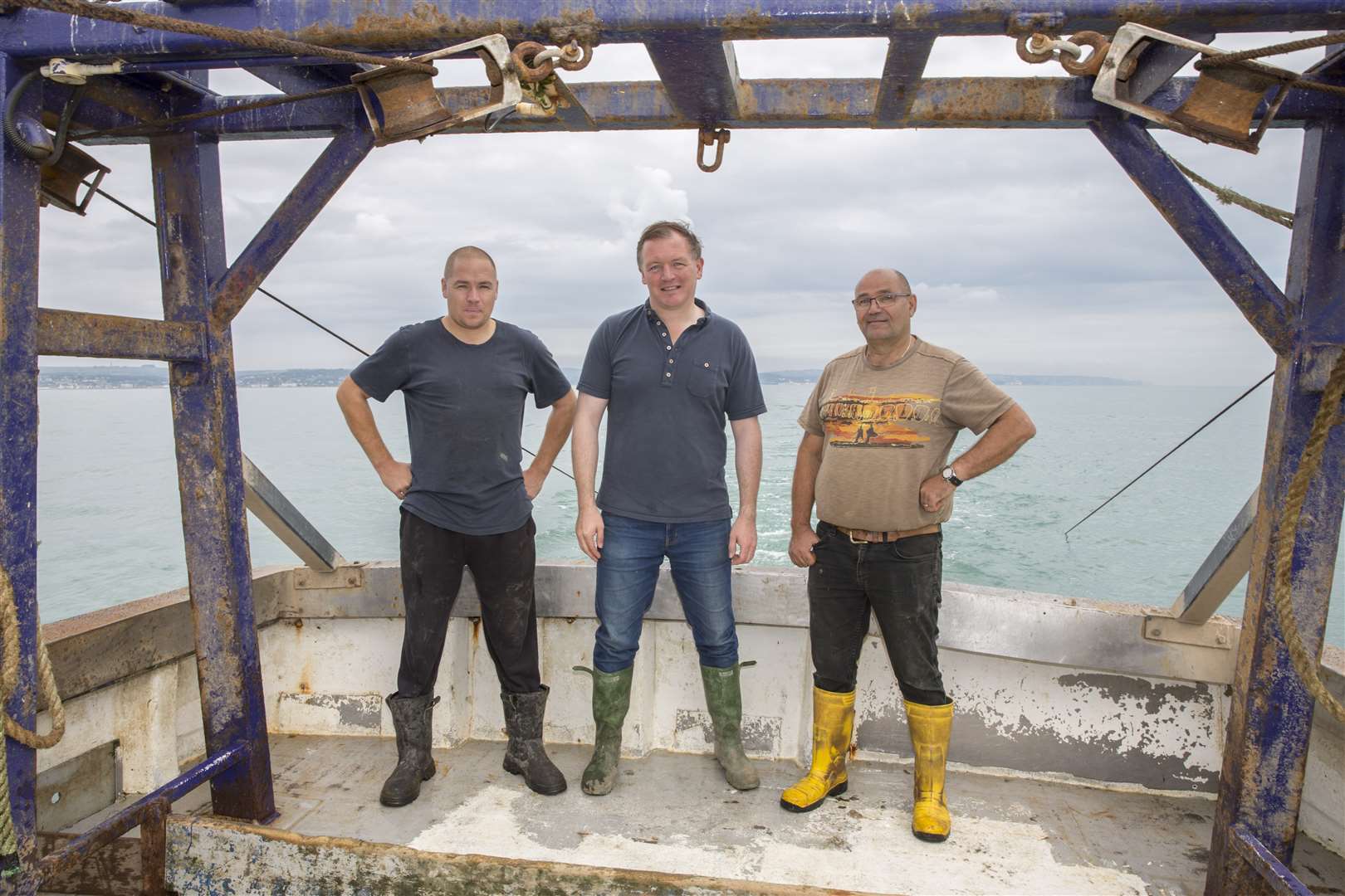 Skipper Luke Noakes, MP Damian Collins and managing director of Folkestone Trawlers Terry Noakes. Picture: © Andrew Aitchison