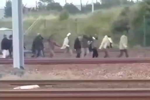 Migrants storming the Channel Tunnel at Calais in the summer
