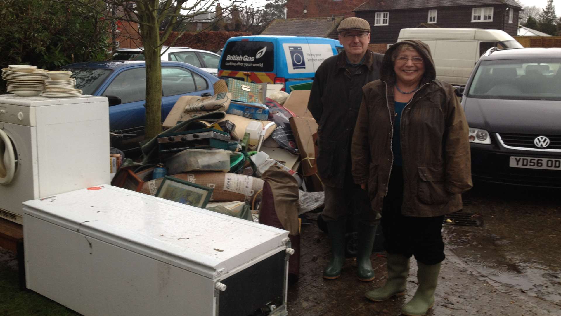 Major Timothy Oyler and wife Trish with their ruined possessions after the floods in Yalding