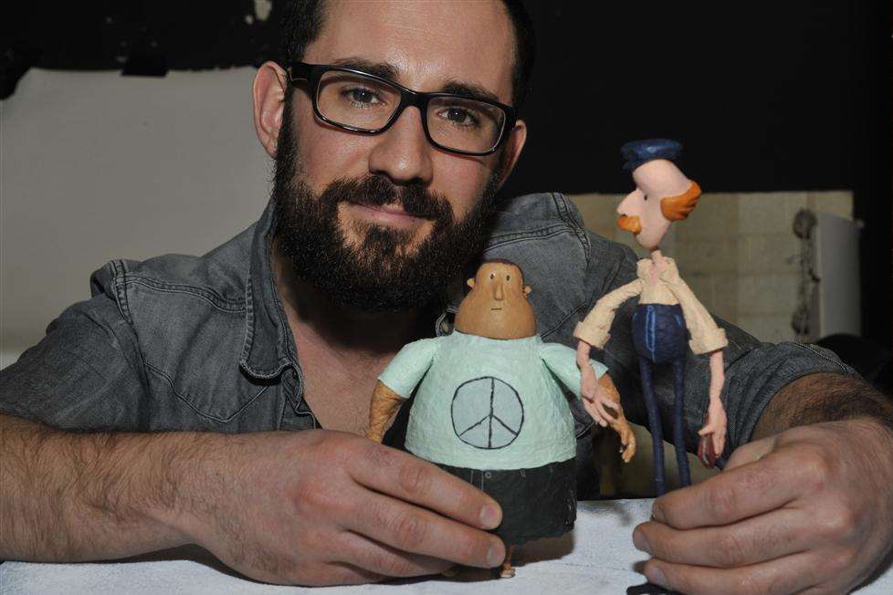 Animate and Create director Dan Richards with two figures made with a layer of tissue paper, to imitate the look of newspaper