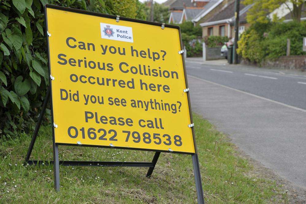 Police sign appealing for witnesses after the crash