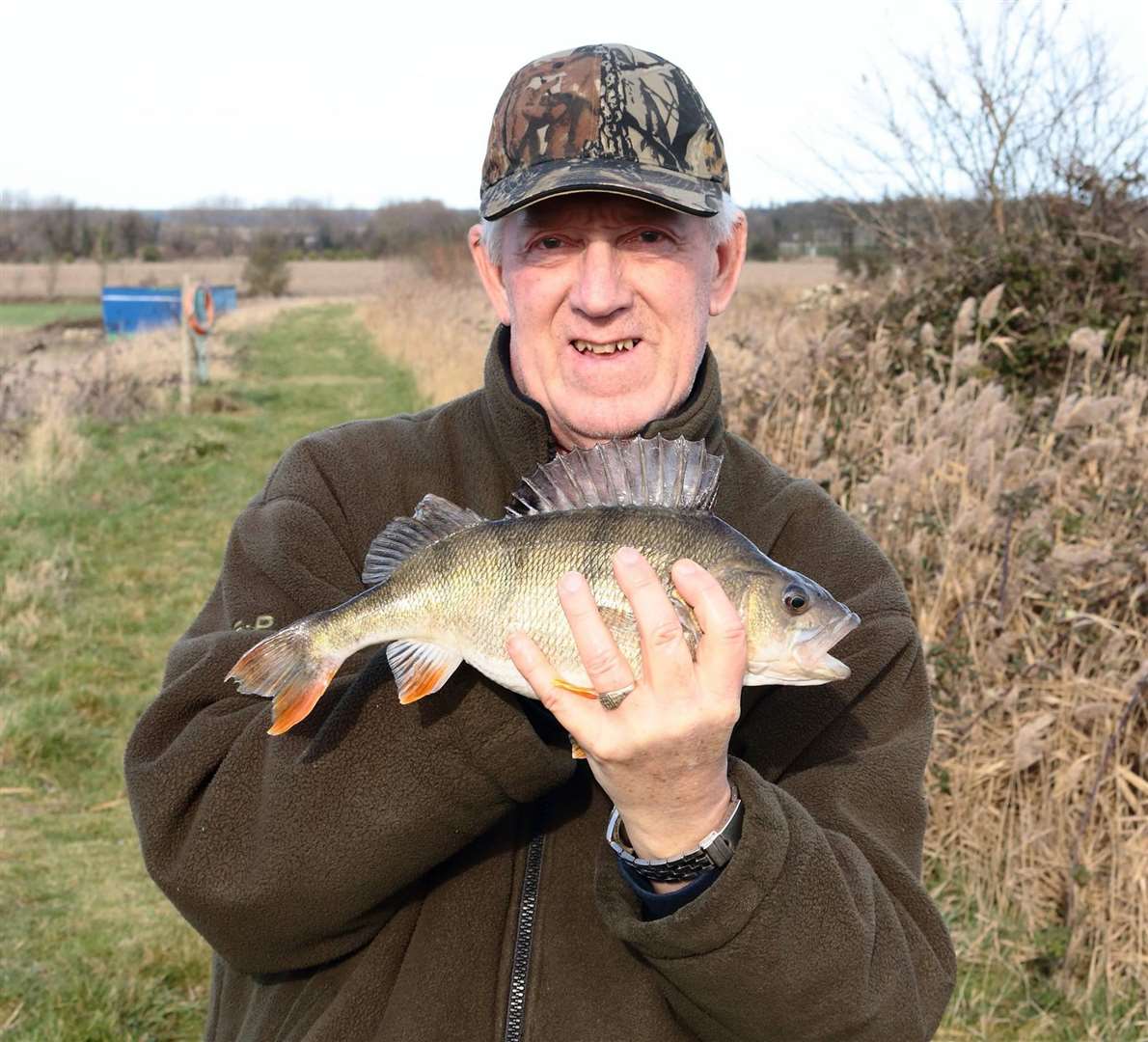 An angler with a perch - one of the hardest fighting fish in our ponds and rivers
